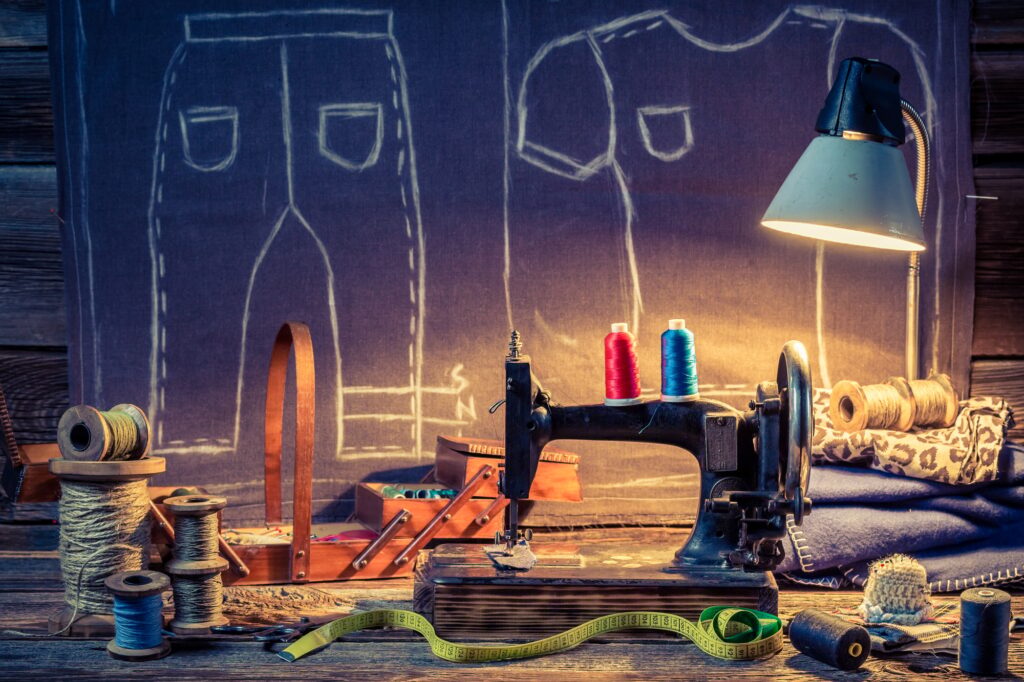 Old sewing workshop with old machine and cloth