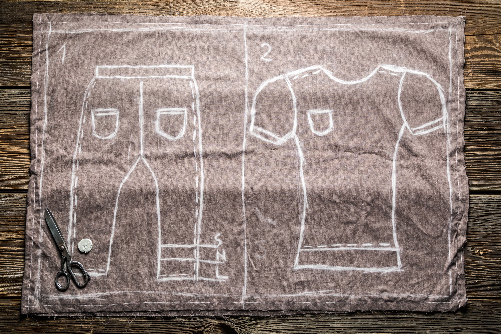 Tailor sketch shirts and trousers on the material