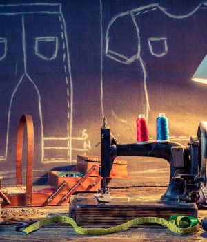 Old sewing workshop with old machine and cloth