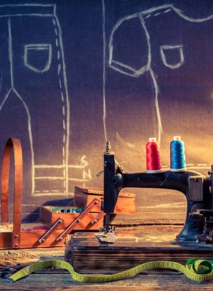 Old sewing workshop with old machine and cloth